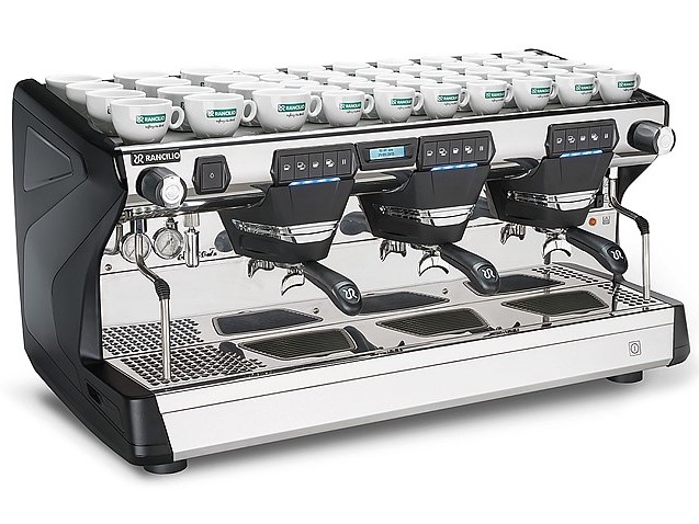 This image is a front-side view of the Rancilio Classe 7 3 group espresso machine in Anthracite Black, with traditional brew group height and USB volumetric dosing controls.